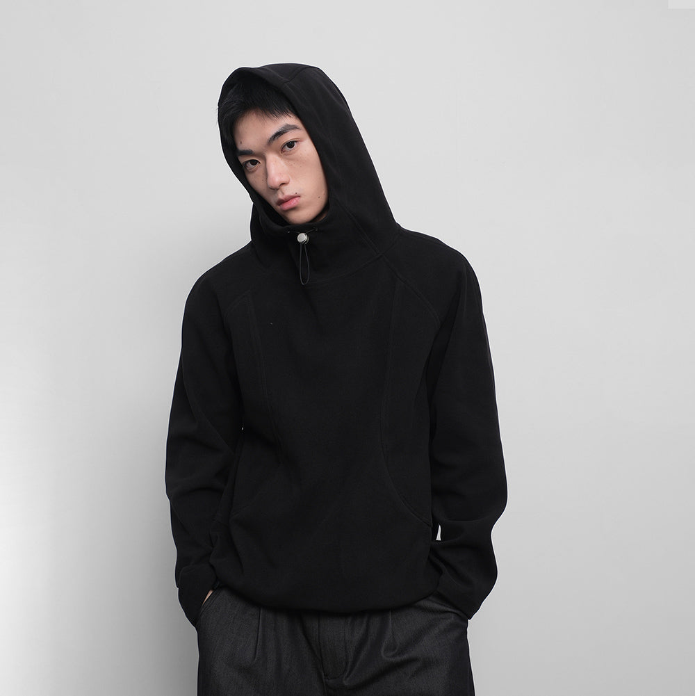Hooded sweatshirt with drawstring hem. Black versatile stand-up collar top.